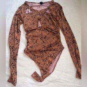 Pebbles cross top long sleeve bodysuit